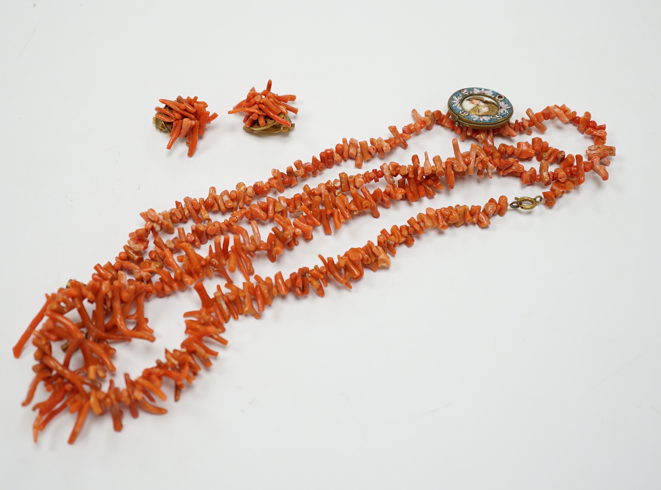 Two jagged coral necklaces, 46cm with a pair of similar earrings and a micro-mosaic and porcelain panel brooch (a.f.).